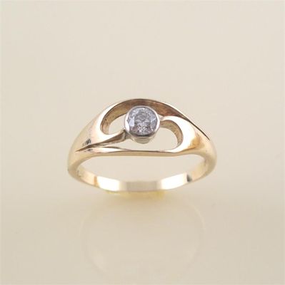 Appraisal: A diamond solitaire ring the scroll pierced gold ring is