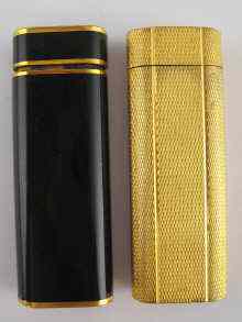 Appraisal: A gold plated Cartier gas lighter with engine turned decoration