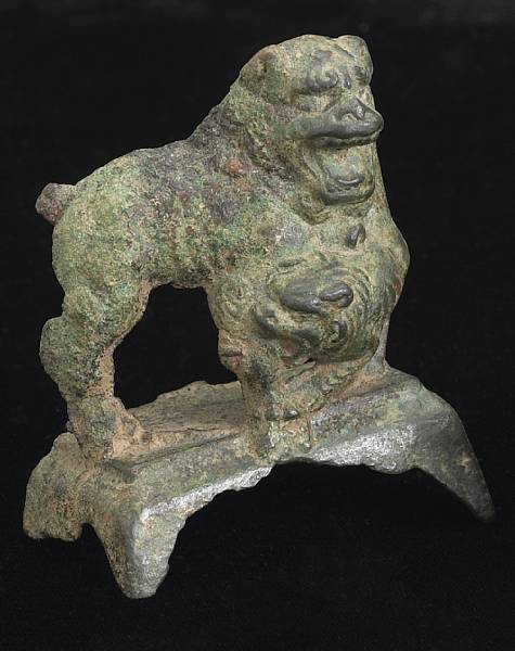 Appraisal: A small bronze lion group Tang Dynasty Depicting a lion