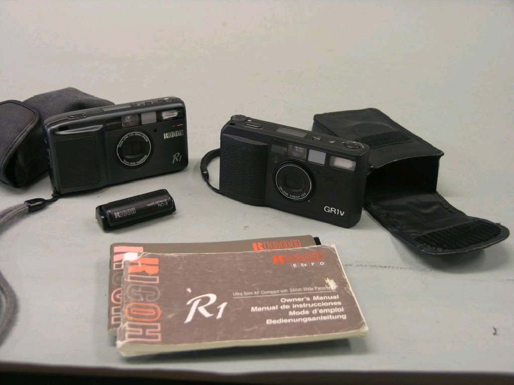 Appraisal: A Ricoh GR V mm compact camera together with a