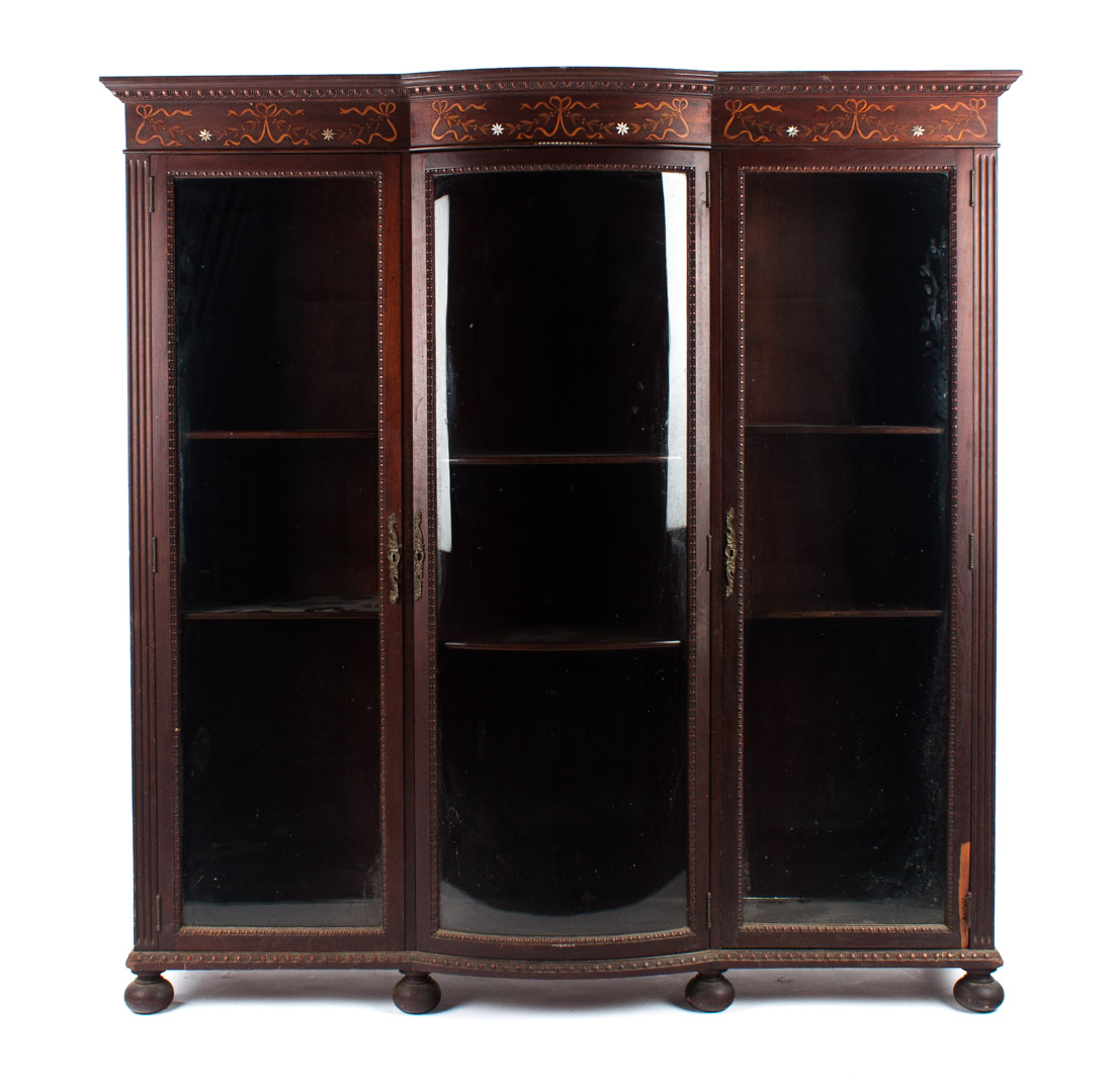 Appraisal: Edwardian inlaid mahogany glass panel bookcase early th century with