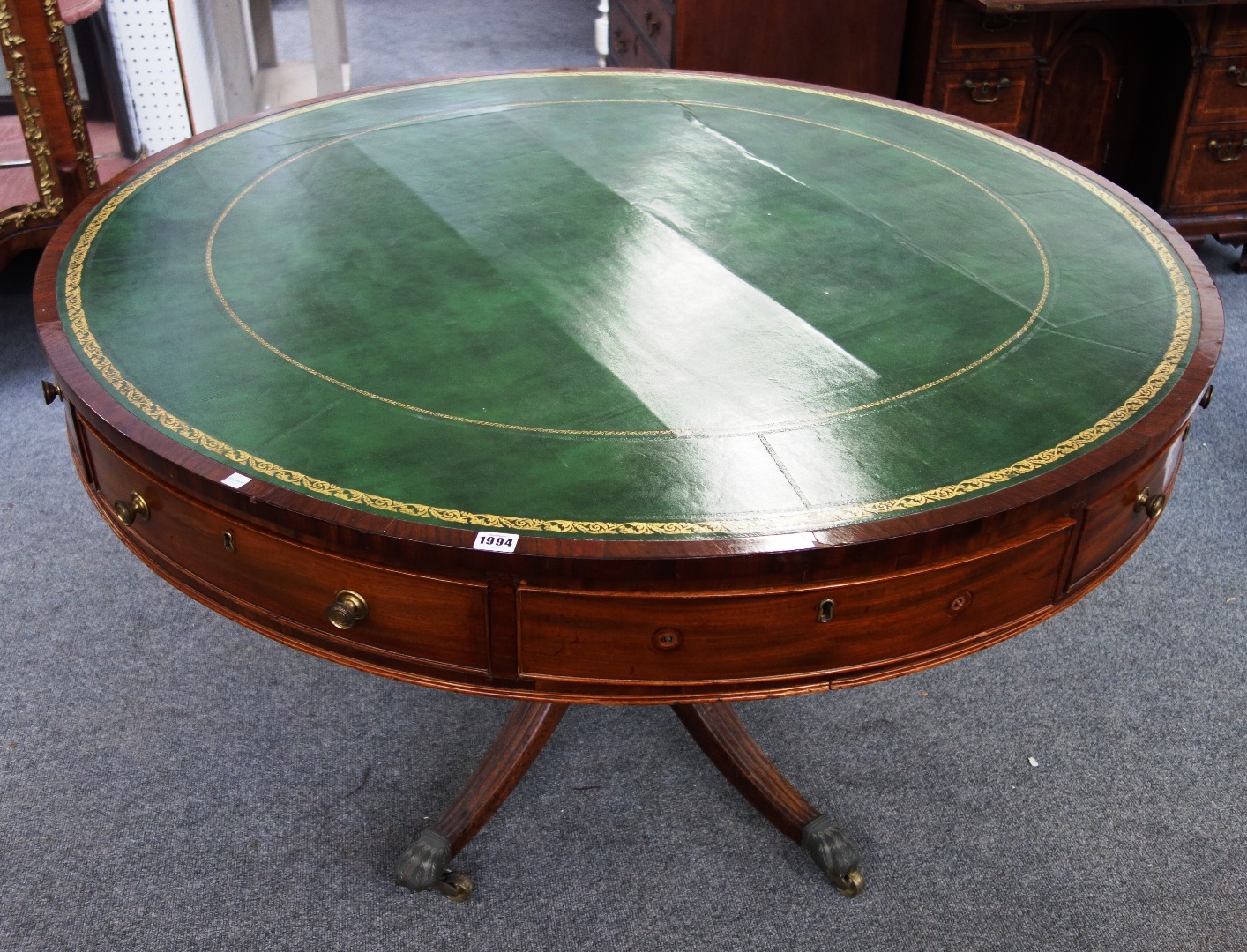 Appraisal: A George III mahogany drum table with leather inset top