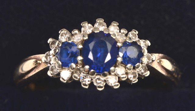 Appraisal: A THREE STONE SAPPHIRE AND DIAMOND SET RING