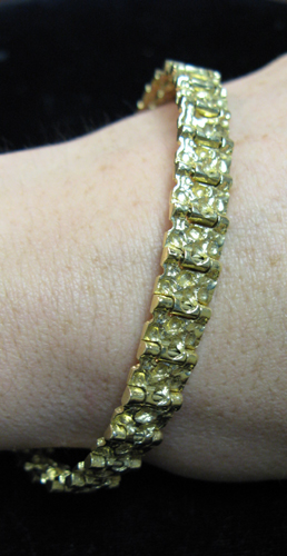 Appraisal: GOLD NUGGET MOTIF BRACELET K yellow gold with gold links