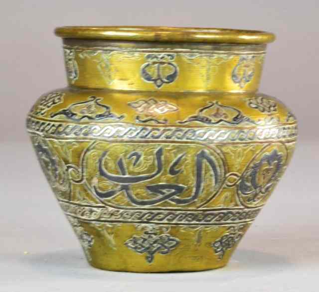 Appraisal: An Islamic Inlaid Brass And Copper JarWith dovetailed foot rim