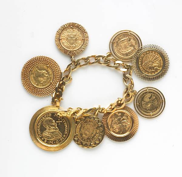 Appraisal: A gold coin and k gold charm bracelet suspending eight