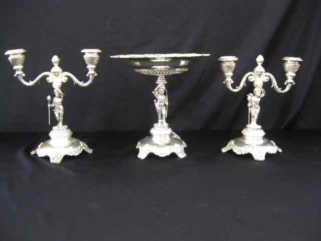 Appraisal: Figural Silverplate Console Set pair of candelabra compote with cupid