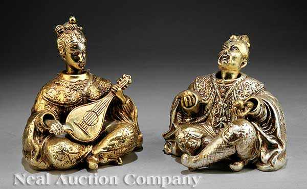 Appraisal: A Pair of Japanese Gilt Porcelain Male and Female Nodder