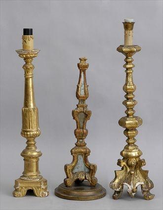 Appraisal: GROUP OF THREE ITALIAN BAROQUE-STYLE CARVED GILTWOOD PRICKET STICK STANDS