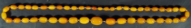 Appraisal: Large string of amber beads