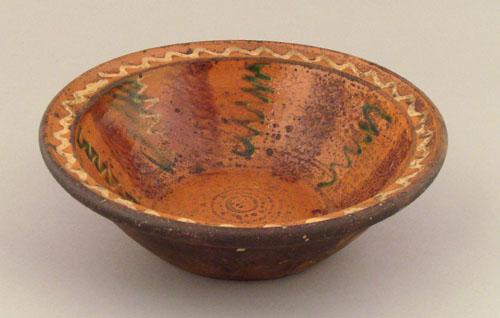 Appraisal: Moravian redware bowl early th c with yellow and green