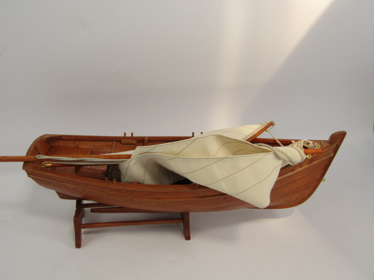 Appraisal: A Leonardo Collection model fishing boat with material sail and