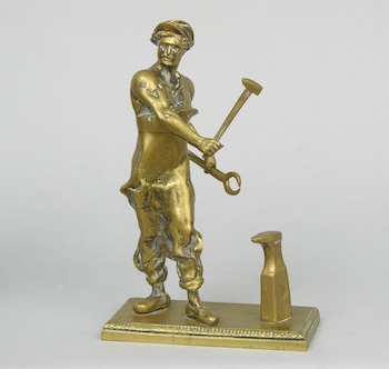 Appraisal: A Bronze Statue Of A Blacksmith An Eastern European bronze