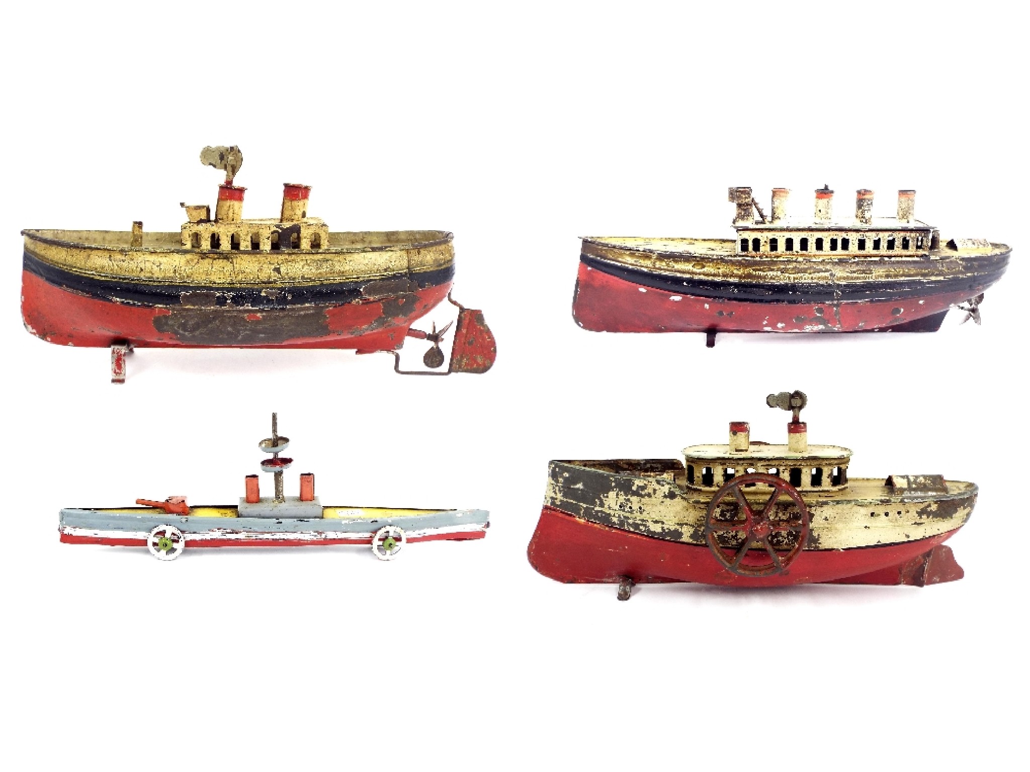 Appraisal: Collection of four German tinplate wind-up toy boats to include