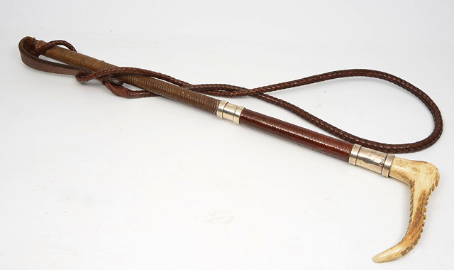 Appraisal: A ZAIR ANTLER AND SILVER MOUNTED LEATHER HUNTING WHIP the