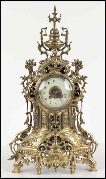 Appraisal: FRENCH GILT METAL MANTLE CLOCK Enamel face and movement are