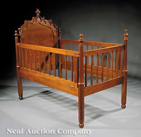 Appraisal: An American Gothic Carved Walnut Child's Bedstead mid- th c