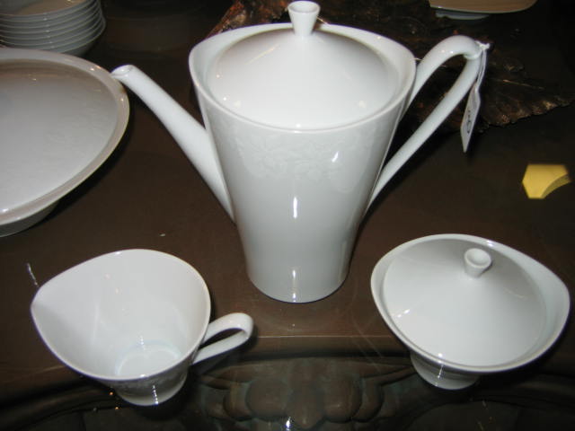 Appraisal: HUTSCHENREUTHER GERMANY White porcelain dinner service including dinner plates cups