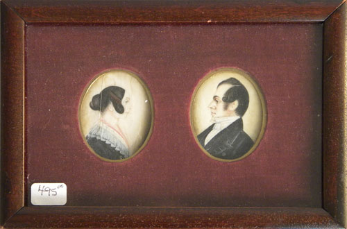 Appraisal: Pair of miniature oval oil on ivory portraits of a