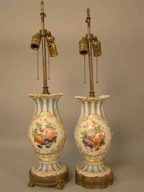 Appraisal: PAIR OF CONTINENTAL PORCELAIN VASES of bulbous shape painted with