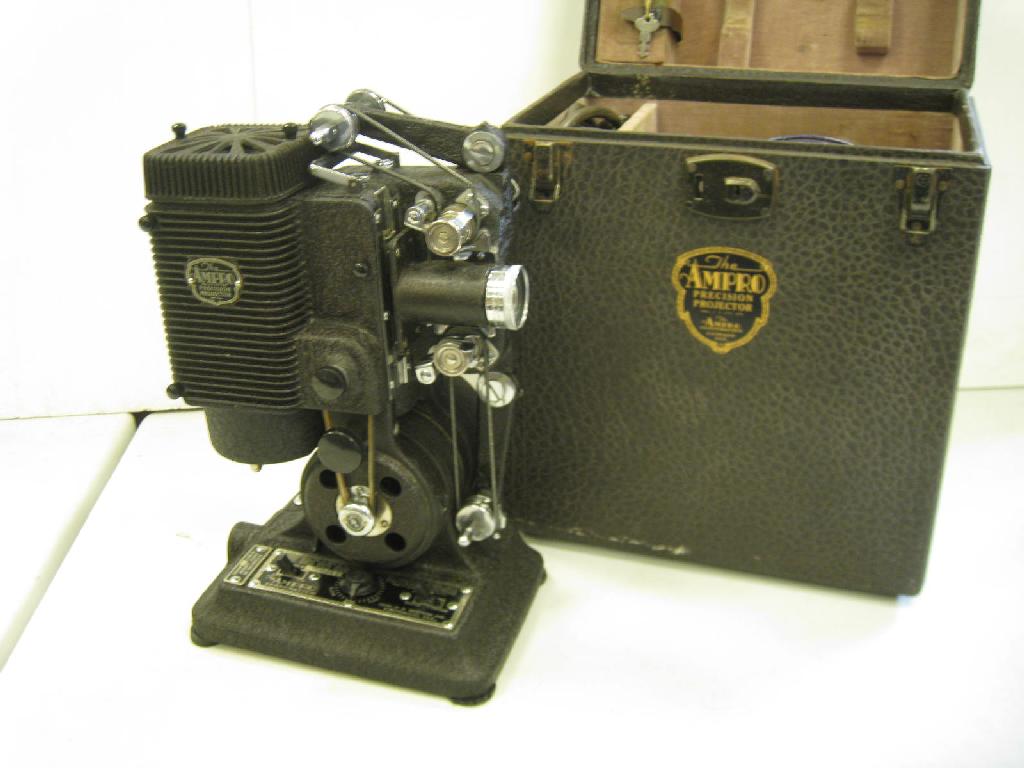 Appraisal: An Ampro precision Projector in original case