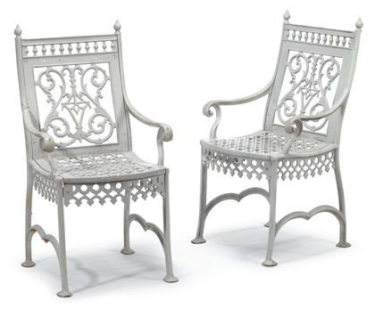 Appraisal: Two white painted cast-iron garden arm chairs late th early