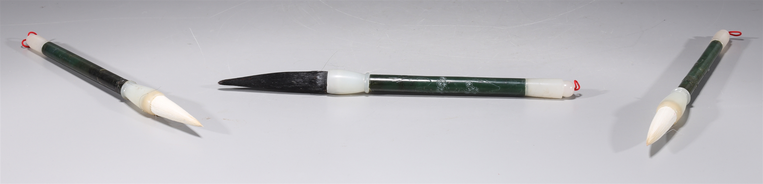 Appraisal: Three Chinese spinach jade paint brushes as-is condition some surface