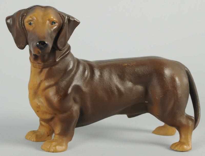 Appraisal: Cast Iron Dachshund Dog Doorstop Made by Hubley cat Marked