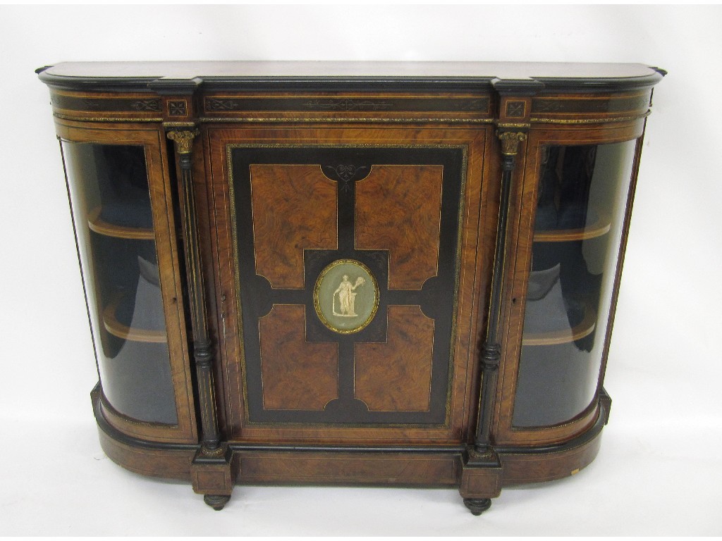 Appraisal: A Victorian walnut and ebonised inlaid credenza the central door