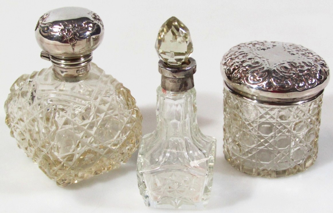 Appraisal: Various silver dressing table pieces comprising a cut glass jar