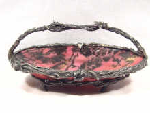 Appraisal: A naturalistic silver and rhodonite basket the silver formed as