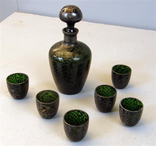 Appraisal: Green glass decanter and stopper with six matching tumblers with