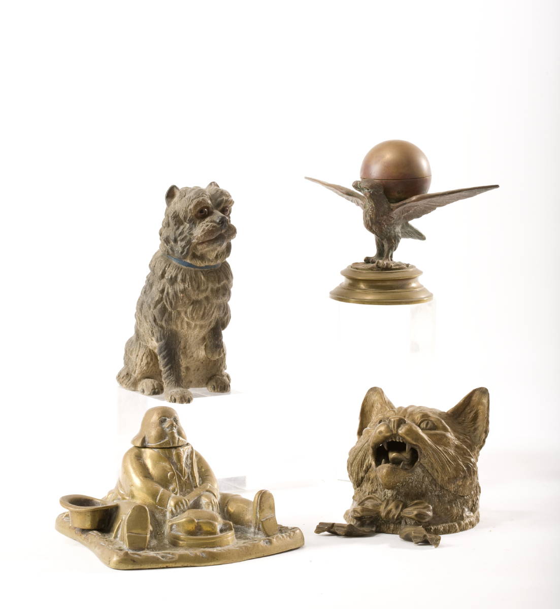 Appraisal: THREE FIGURAL PATINATED METAL INKWELLS AND A POLYCHROME PAINTED FIGURE