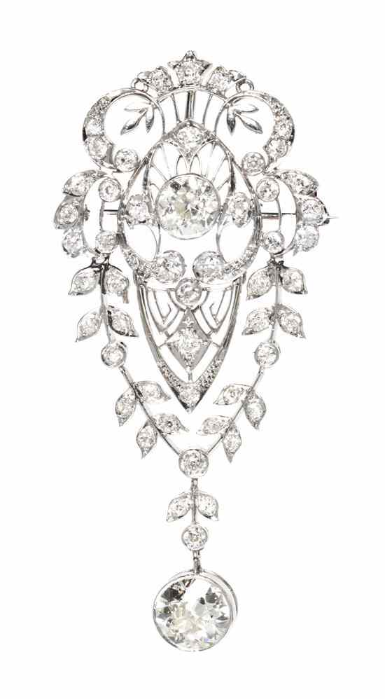 Appraisal: An Edwardian Platinum and Diamond Brooch in an open filigree