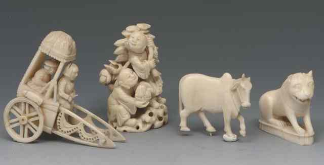 Appraisal: A SMALL GROUP OF CARVED IVORY ITEMS to include a