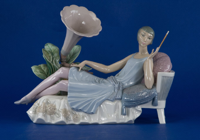 Appraisal: Lladro Figure Art deco lady reclining on a chaise lounge