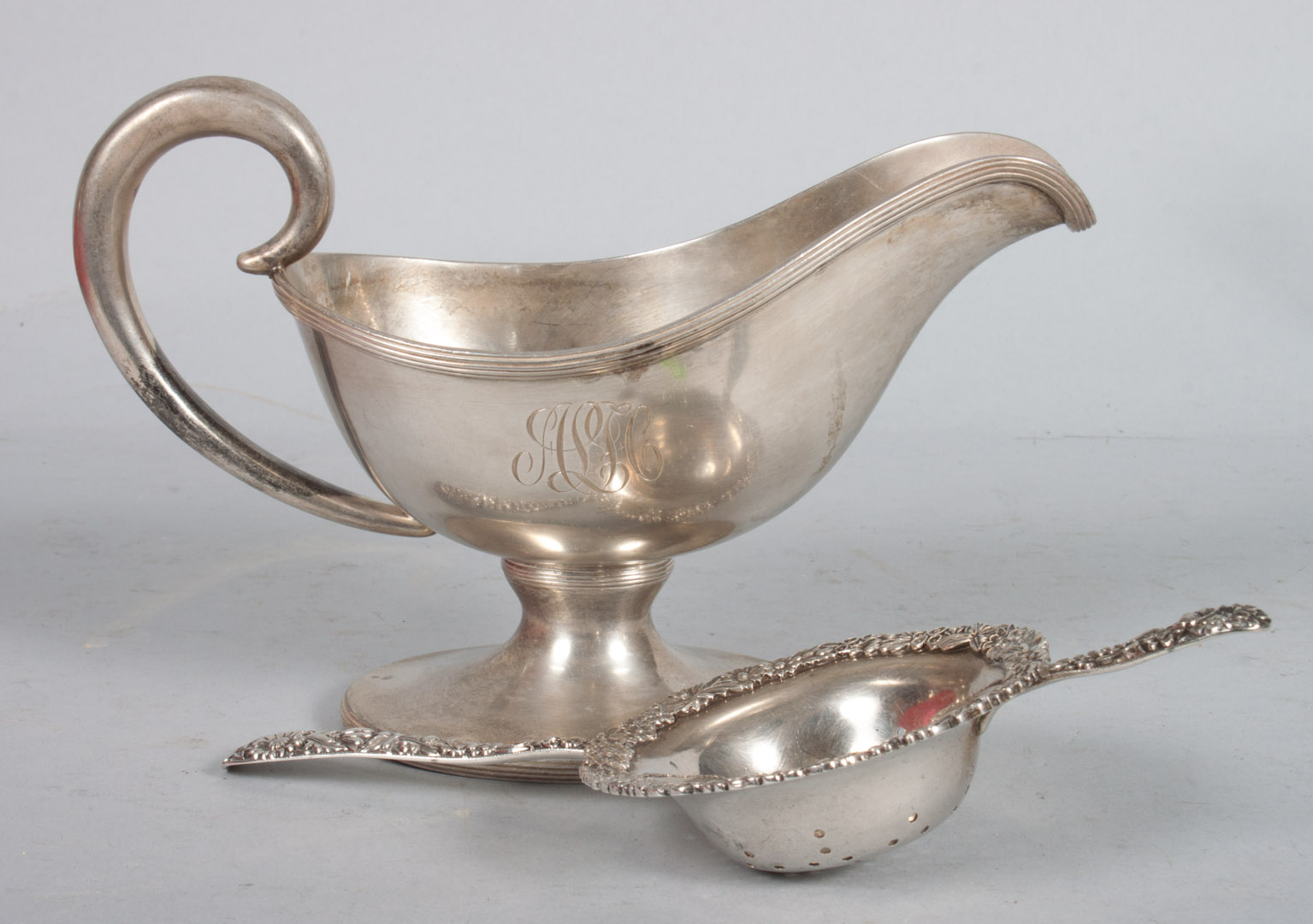 Appraisal: Kirk sterling gravy boat repousse tea strainer ozt t w