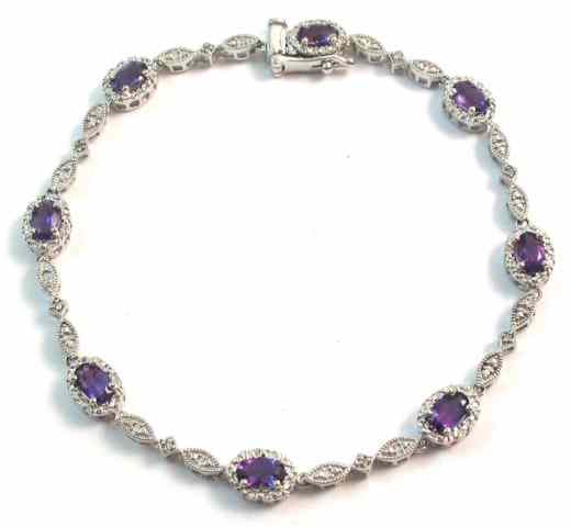 Appraisal: AMETHYST AND DIAMOND BRACELET The k white gold bracelet is