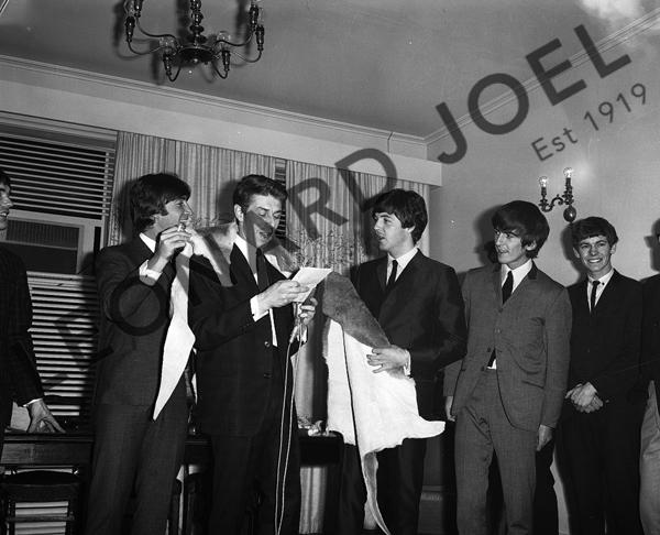 Appraisal: THE BEATLES RECEIVING ANIMAL SKINS AT CONFERENCE RECEPTION x cm