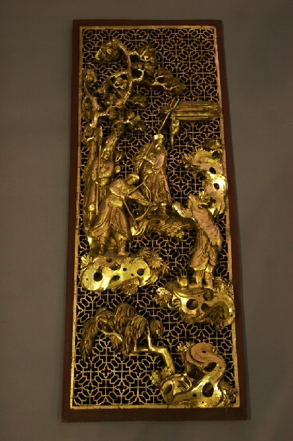 Appraisal: A Chinese carved gilt wood wall plaque depicting courtiers in