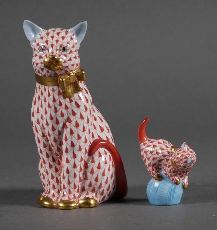 Appraisal: Two Herend white porcelain cats with hand painted rust fishnet