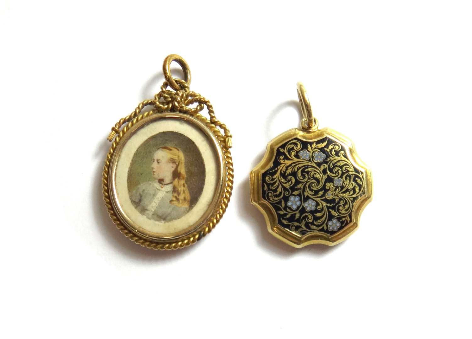 Appraisal: A Victorian gold and enamelled shaped circular pendant mourning locket