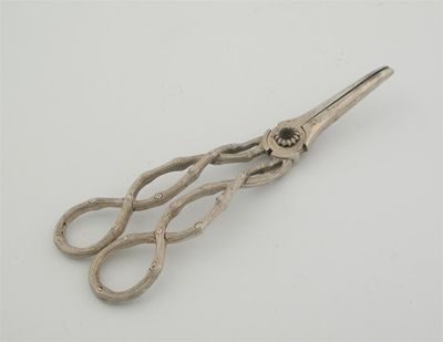 Appraisal: A pair of Victorian cast grape shears with openwork tendril