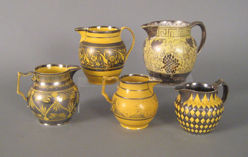 Appraisal: Five canary and silver resist pitchers early th c to