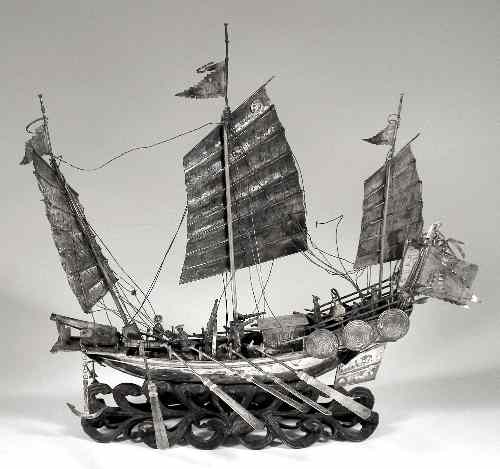 Appraisal: A Chinese silvery metal model of an armed junk with