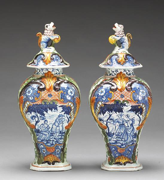 Appraisal: A pair of Dutch polychrome Delft covered baluster vases th