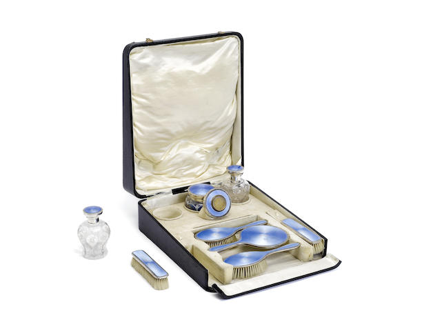 Appraisal: A th century silver-mounted and blue enamel cased dressing set