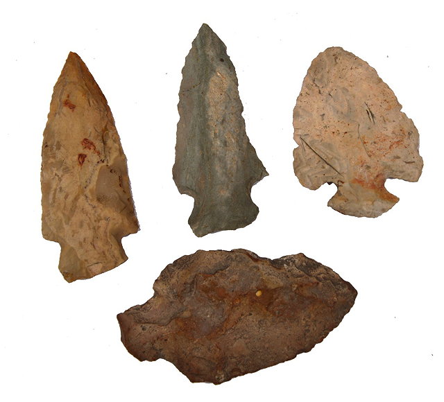 Appraisal: A COLLECTION OF FOUR NATIVE AMERICAN CARVED STONE ARROW HEADS