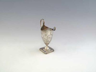 Appraisal: A George III bright-engraved helmet cream jug on a square