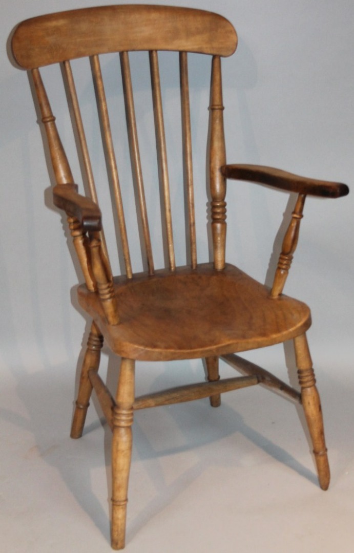 Appraisal: An early thC ash and elm grandfather chair the shaped